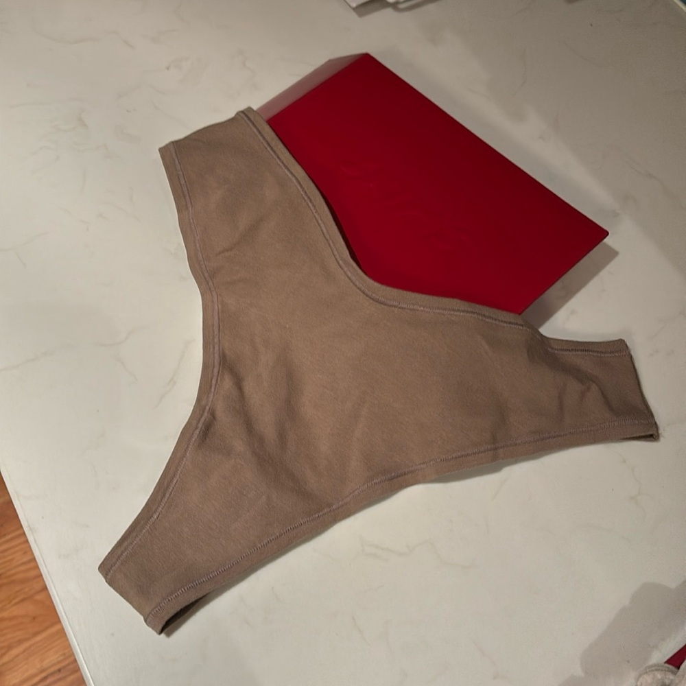 Skims cotton dipped thong size L
